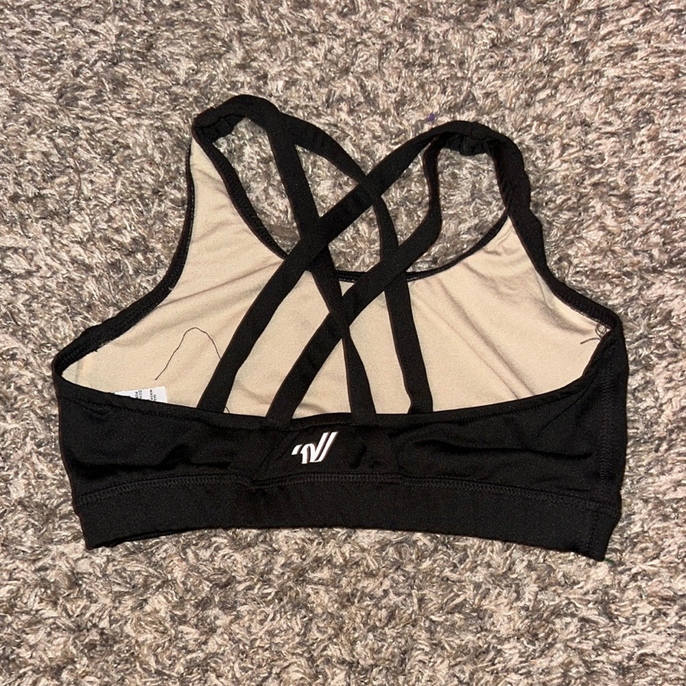 Varsity Black Sports Bra with Strappy Details and Seamless Design